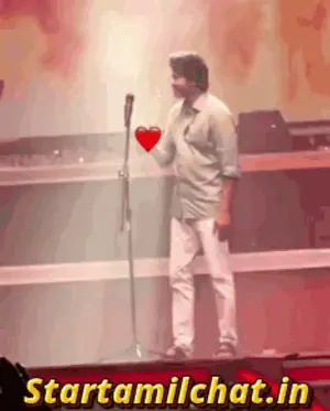 A Man Is Holding A Heart In Front Of A Microphone And The Website Starttamilchat.In Is Behind Him