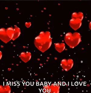 A Bunch Of Red Hearts Are Flying In The Air On A Black Background And The Words `` I Miss You Baby And I Love You ''
