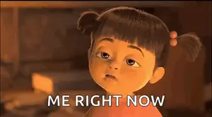 A Cartoon Girl From The Movie Monsters Inc Is Looking At The Camera And Saying `` Me Right Now '' .