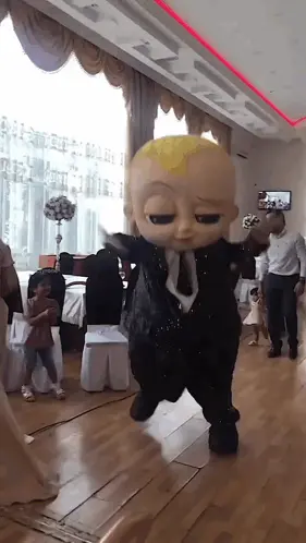 A Baby Doll In A Suit And Tie Is Dancing