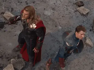 Thor And Captain America Are Standing Next To Each Other On The Ground