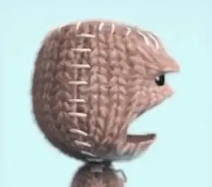 A Close Up Of A Knitted Ball With Stitching On It