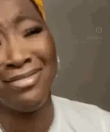 A Close Up Of A Woman Making A Funny Face .