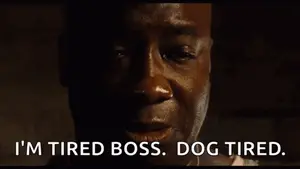 A Man Says I 'M Tired Boss Dog Tired In A Dark Room