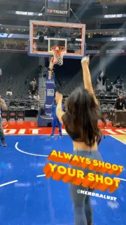A Woman Stands On A Basketball Court With The Words Always Shoot Your Shot On The Bottom