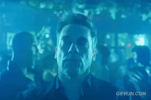 A Man Dancing In A Club With A Gifrun.Com Watermark