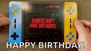 A Person Is Holding A Video Game Console That Says Gamers Don 'T Have Birthdays .