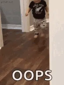 A Baby Is Running Through A Doorway With The Word Oops Written On The Floor .