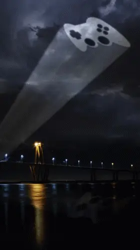 A Video Game Controller Is Being Projected Over A Bridge
