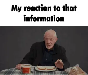 A Man Is Sitting At A Table With A Plate Of Food And A Cup Of Coffee With The Words " My Reaction To That Information " Below Him