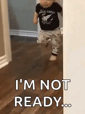 A Baby Is Running Through A Doorway With The Words `` I 'M Not Ready '' Written On The Floor .