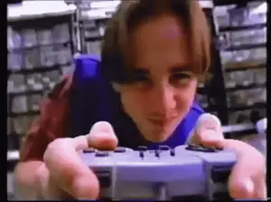 A Young Man Is Playing A Video Game With A Controller In His Hands .