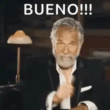 A Man With A Beard Is Giving A Thumbs Up Sign And The Word Bueno Is Above Him .