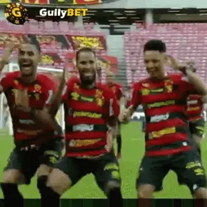 A Group Of Soccer Players Are Dancing On A Field