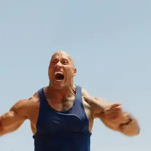 A Man In A Blue Tank Top With His Mouth Open