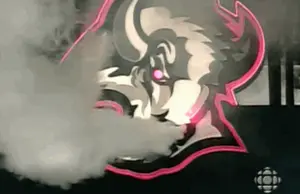 A Logo For A Sports Team With Smoke Coming Out Of It 'S Mouth