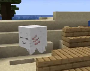 A White Block With A Red And Black Checkered Face Is Sitting On A Set Of Stairs In A Video Game