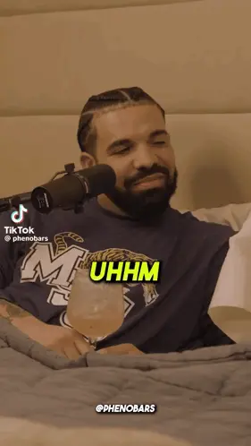 A Man Sitting In Front Of A Microphone With The Words " I 'D Do It " On The Screen