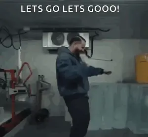 A Man In A Blue Jacket Is Dancing In A Room With The Words `` Lets Go Lets Gooo '' Written Above Him .