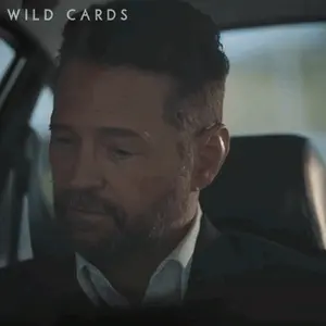 A Man With A Beard Is Sitting In A Car And Says " Whatever You Say Boss "