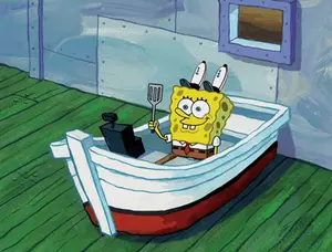 Spongebob Holding A Spatula In A Small Boat