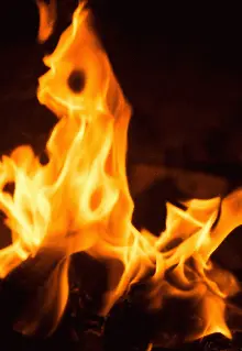 A Close Up Of A Burning Fire With A Black Background