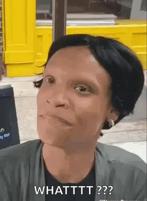 A Woman Is Making A Funny Face And Says Whatttt