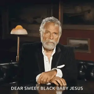 A Man Sitting At A Table With The Words Dear Sweet Black Baby Jesus Written Below Him