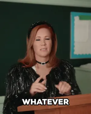 A Woman Behind A Podium Says Whatever