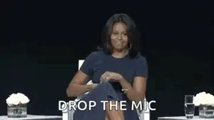 Michelle Obama Is Sitting In A Chair With A Microphone In Her Hand And Says `` Drop The Mic '' .