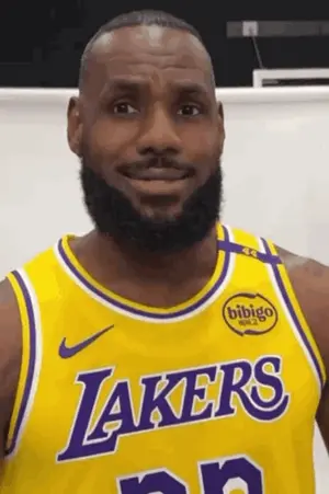 A Man With A Beard Wears A Yellow Lakers Jersey