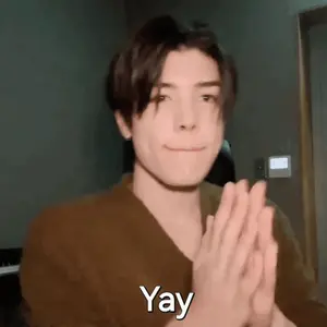 A Young Man Is Clapping His Hands And The Word Yay Is On The Bottom Right