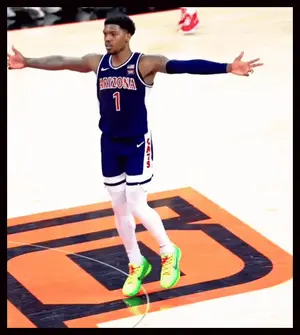 A Basketball Player With The Number 1 On His Jersey Stands On The Court