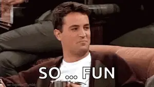 A Man Is Sitting On A Couch Holding A Cup And Saying `` So Fun '' While Holding A Cup Of Coffee .