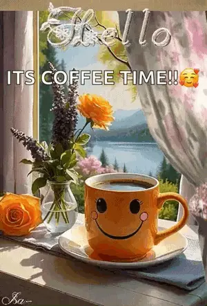 A Cup Of Coffee With A Smiley Face Sits On A Table Next To Flowers