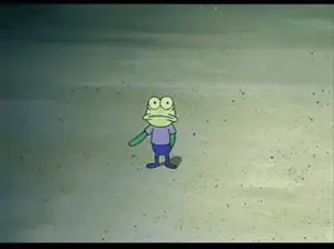 A Frog From Spongebob Squarepants Is Standing On A Beach .