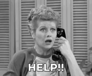 A Black And White Photo Of A Woman Talking On A Telephone And Asking For Help .