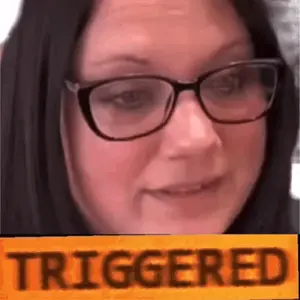 A Close Up Of A Woman Wearing Glasses And A Yellow Sign That Says Triggered .