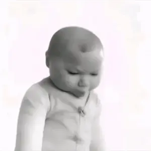 A Black And White Photo Of A Baby With A White Background