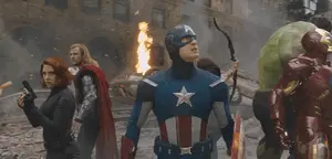 A Group Of Superheros Including Captain America Are Standing In Front Of A Fire