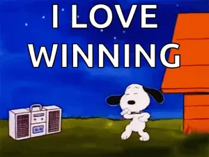 A Cartoon Of Snoopy Dancing In Front Of A Boombox That Says " I Love Winning "