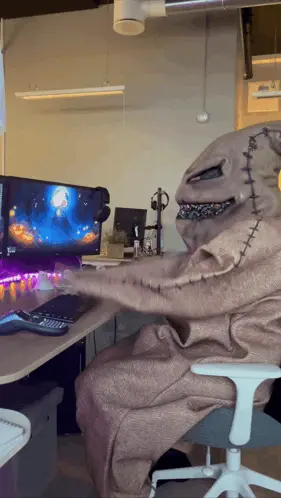 A Nightmare Before Christmas Character Is Sitting In Front Of A Computer Screen