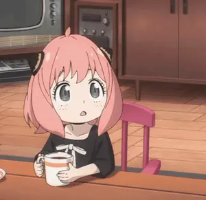 A Little Girl With Pink Hair Is Sitting At A Table With A Cup Of Coffee