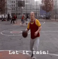 A Man Holding A Basketball On A Basketball Court With The Words Let It Rain Written Below Him