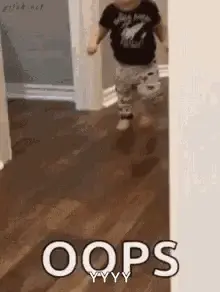 A Baby Is Running Through A Hallway With The Words `` Oops '' Written On It .