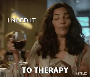 A Woman Is Holding A Glass Of Wine And Saying I Need It To Therapy