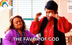 Two Women Are Dancing In A Classroom With The Words `` The Favor Of God '' Written On The Bottom .