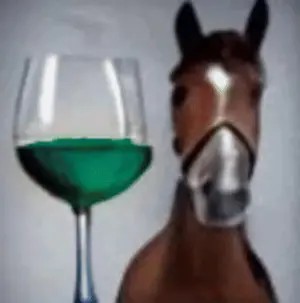 A Horse Is Standing In Front Of A Glass Of Green Liquid