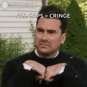 A Man From Schitt 'S Creek Is Making A Funny Face While Holding His Hands Together .