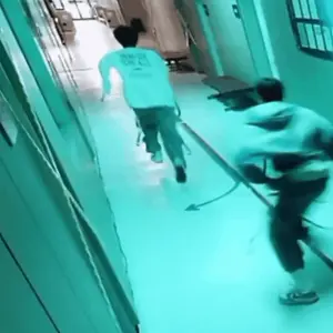 A Person Running Down A Hallway With A Shirt That Says " Never Give Up " On It